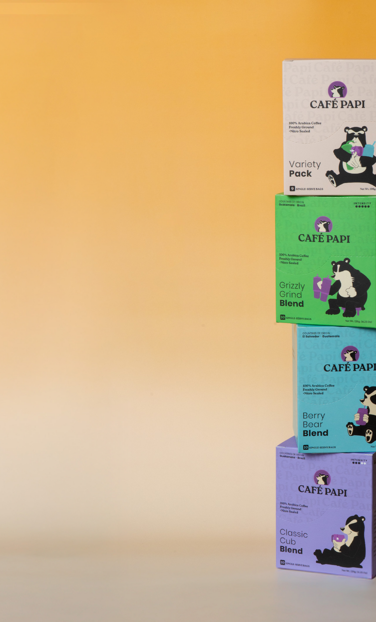 Stack of Cafe Papi coffee boxes on a gradient background